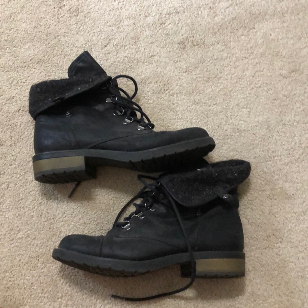 Black flap over boots